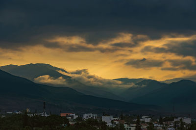Scenic view of silhouette mountains against sky during sunset