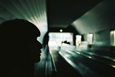 Portrait of man seen through train window