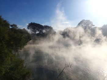 Scenic view of volcanic lake against sky