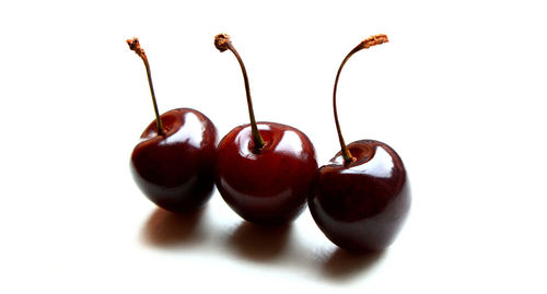 Close-up of fruit over white background