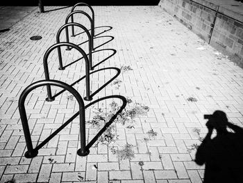 Shadow of woman on sidewalk
