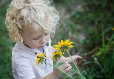 Close-up of girl holding flower