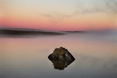 Scenic view of sea at sunset