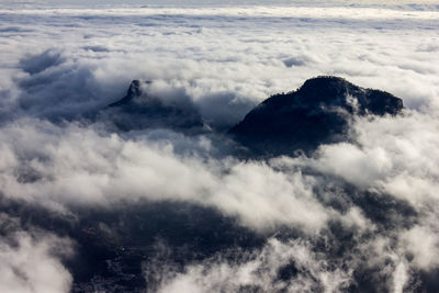 Mountains among a sea of clouds.