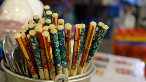 Close-up of multi colored sticks on table