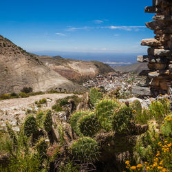 Scenic view of landscape and buildings against sky