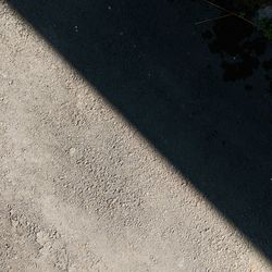 High angle view of shadow on sand