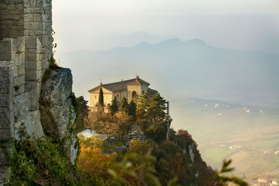 Panoramic view of buildings and mountains against sky