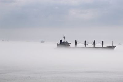 Boat in sea against sky