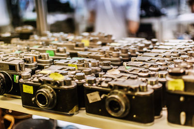 Close-up of retro styled cameras for sale at market