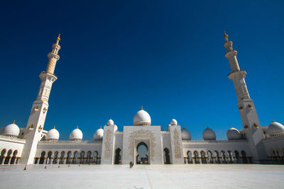 View of historical building against clear blue sky