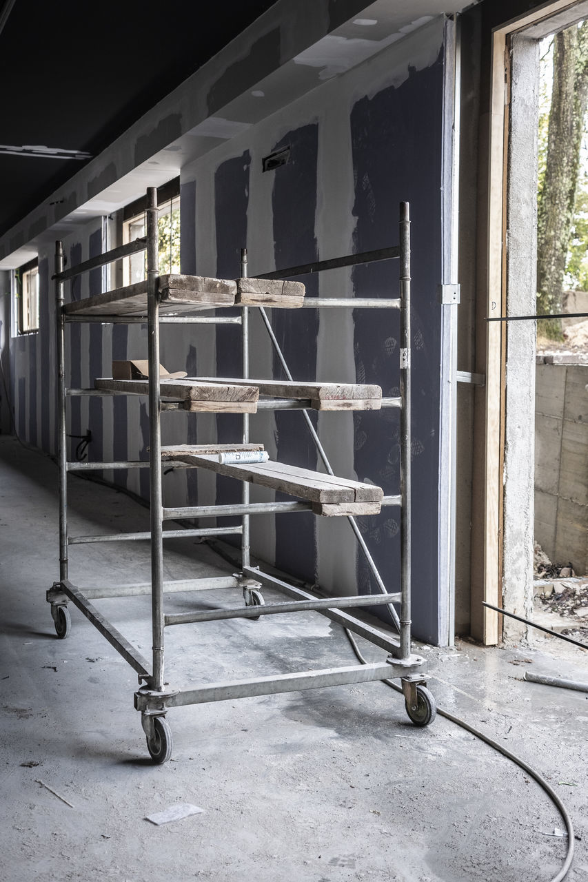 EMPTY CHAIRS ON ABANDONED HOUSE