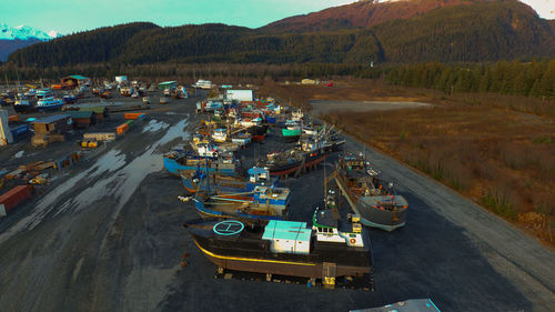 High angle view of cars on road by mountains