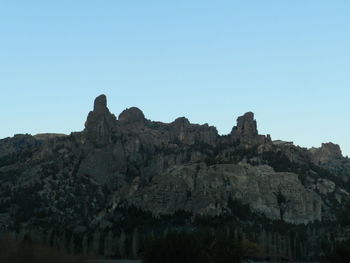 Scenic view of rocky mountains against clear sky