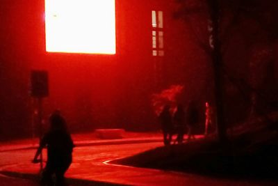 Blurred motion of woman at night