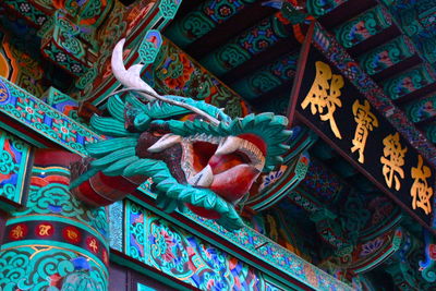 Low angle view of dragon statue on temple