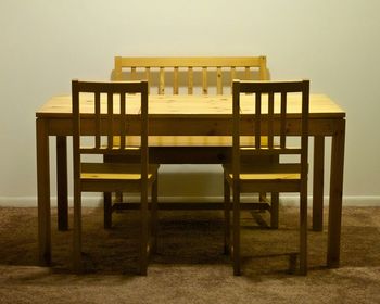 Wooden chairs and tables in room