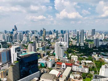 High angle view of modern buildings in city against sky