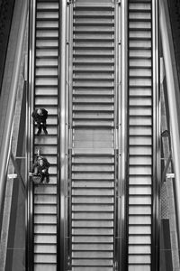 People on escalator at railroad station