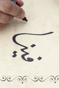Close-up of hand holding paper