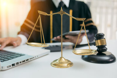 Close-up of hand on table