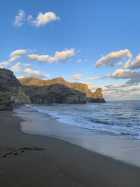 Scenic view of beach against sky