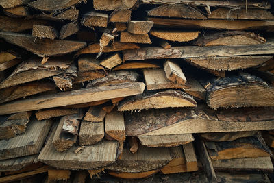 Closeup of a stack of logs, old dusty firewood