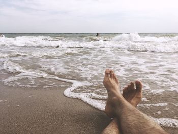 Low section of person on beach