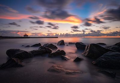 Scenic view of sea against sky during sunset