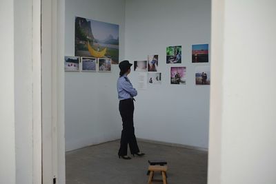 Rear view of man standing in corridor