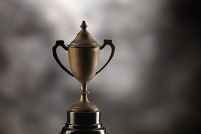 Close-up of trophy on against black background