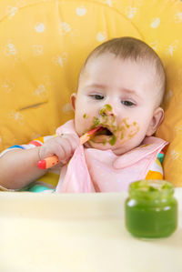 High angle view of cute girl eating food