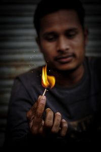 Man with burning matchstick