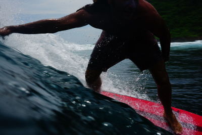 Man splashing water in sea