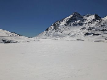 Scenic view of snow mountains against sky