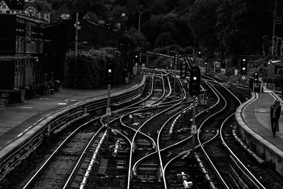 High angle view of railroad tracks on road in city