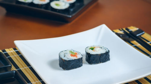 Close-up of sushi served on table