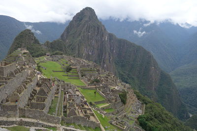 High angle view of ruins of mountain against cloudy sky