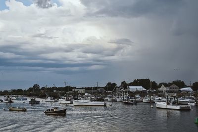 Boats sailing in sea against sky