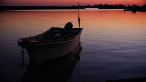 Hisamatsu fishing port and boat in red at sunset miyakojima, a remote island in okinawa prefecture