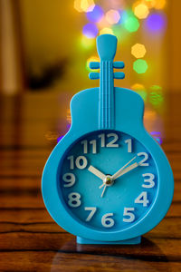 Close-up of clock on table