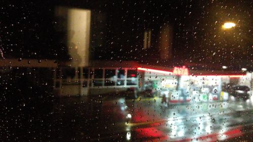 Raindrops on window at night