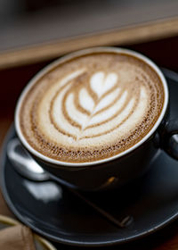 Close-up of cappuccino on table