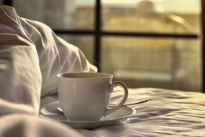 Close-up of coffee cup on table