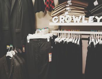 Row of clothes hanging in store