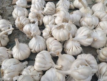 Full frame shot of white garlics for sale in market