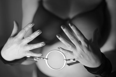 Midsection of woman with handcuffs