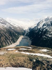 Scenic view of snow covered mountains against sky