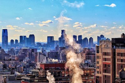 Buildings in city against sky