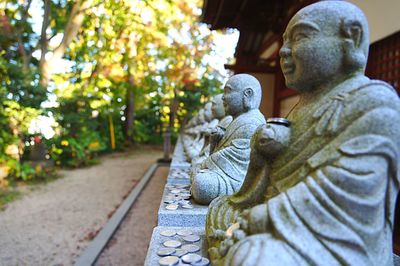 Statue of buddha against temple